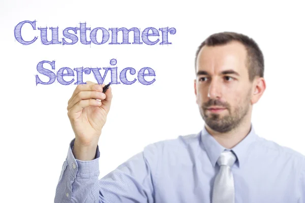 Služby zákazníkům - mladý podnikatel s modrým textem — Stock fotografie