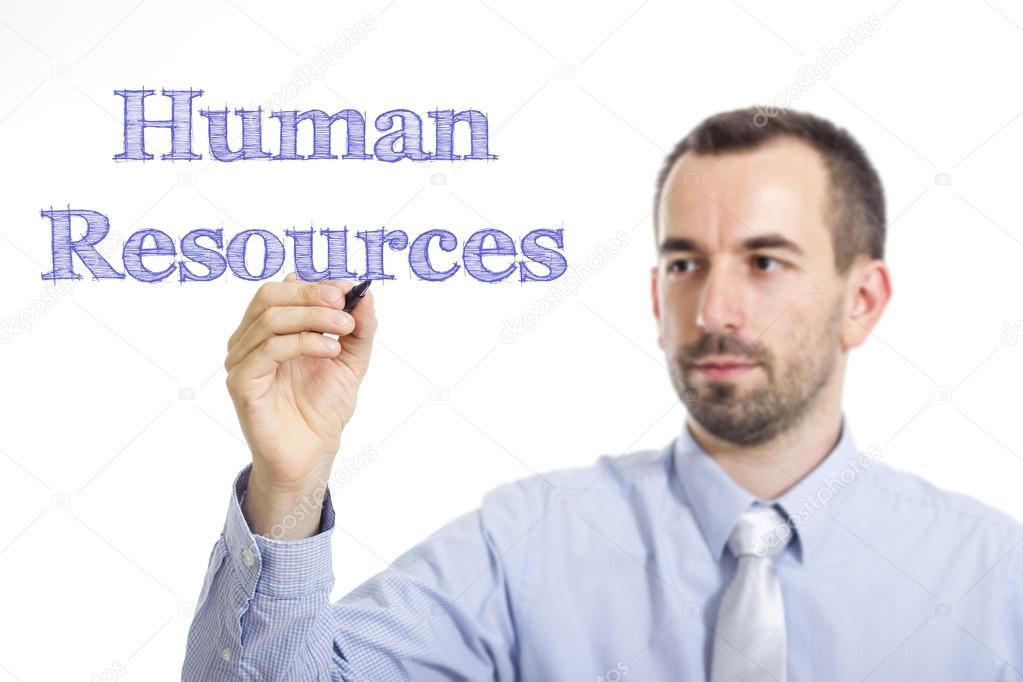 Human Resources - Young businessman writing blue text