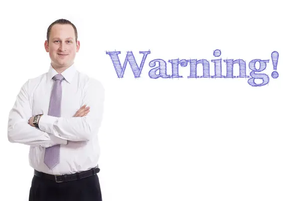 Warning!  - Young businessman with blue text — Stock Photo, Image