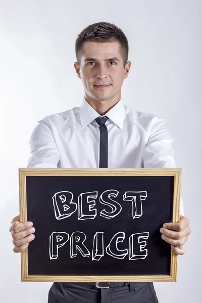 BEST PRICE - Young businessman holding chalkboard with text — Stock Photo, Image