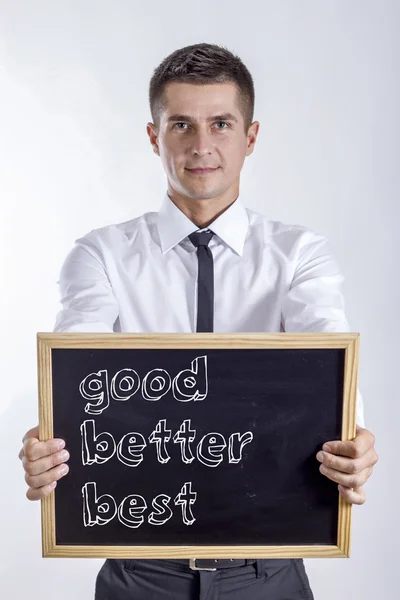 Bra bättre bäst - ung affärsman holding svarta tavlan — Stockfoto