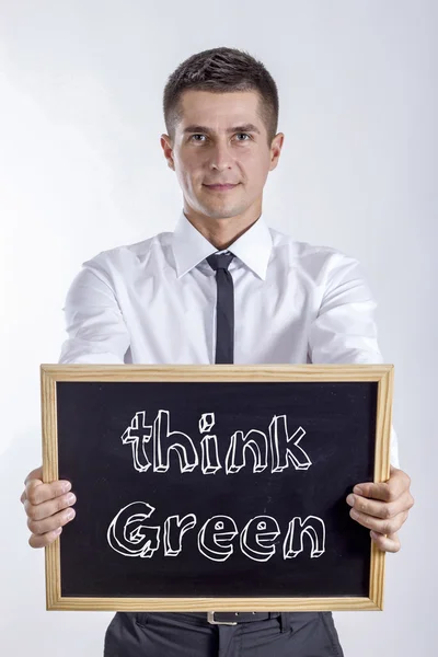 Gondolom, a zöld! -Fiatal üzletember gazdaság chalkboard — Stock Fotó