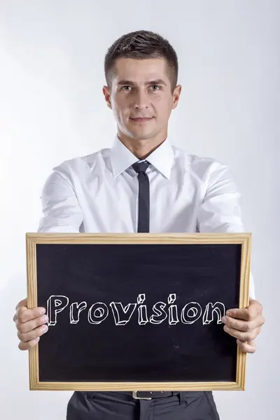 Provision - Young businessman holding chalkboard — Stock Photo, Image