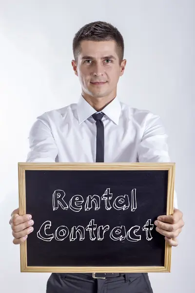 Rental Contract - Young business holding chalkboard — Stok Foto