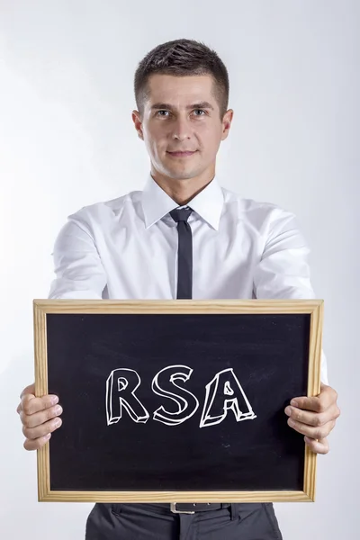 RSA - Jovem empresário segurando quadro — Fotografia de Stock