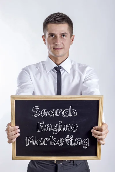 Search Engine Marketing SEM - Young businessman holding chalkboard — Stock Photo, Image