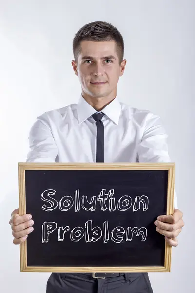 Solution Problem - Young businessman holding chalkboard — Stock Photo, Image