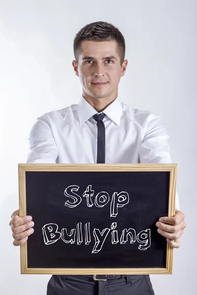 Zastavení šikany - mladý podnikatel drží tabuli — Stock fotografie