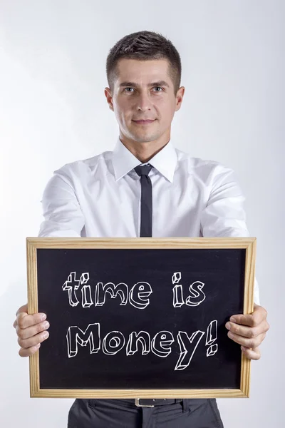 Le temps c'est de l'argent ! - Jeune homme d'affaires tenant un tableau noir — Photo