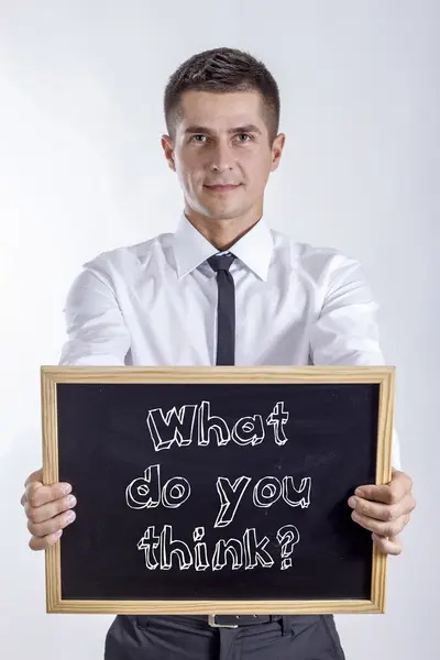 Mit gondolsz? -Fiatal üzletember gazdaság chalkboard — Stock Fotó