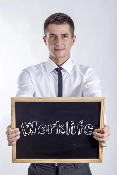 Worklife - mladý podnikatel drží tabuli — Stock fotografie