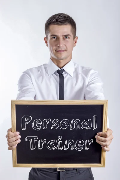 Personal Trainer - Jovem empresário segurando quadro — Fotografia de Stock