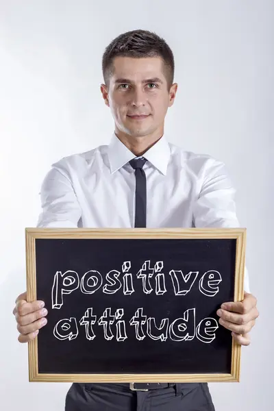 Atitude positiva - Jovem empresário segurando quadro — Fotografia de Stock