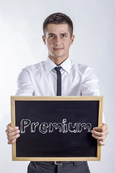 Premium - Young businessman holding chalkboard — Stock Photo, Image