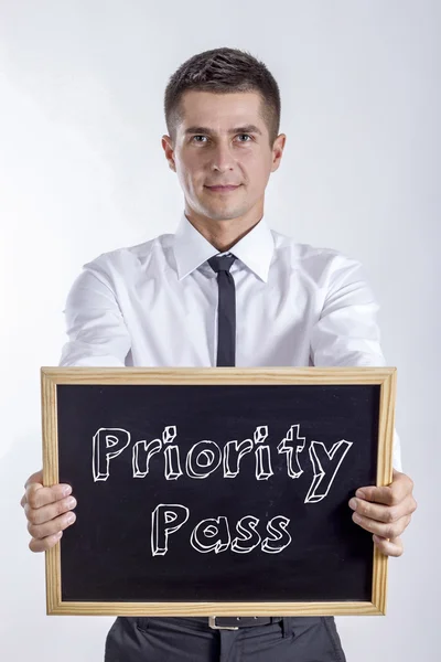 Priority Pass - Joven empresario con pizarra —  Fotos de Stock