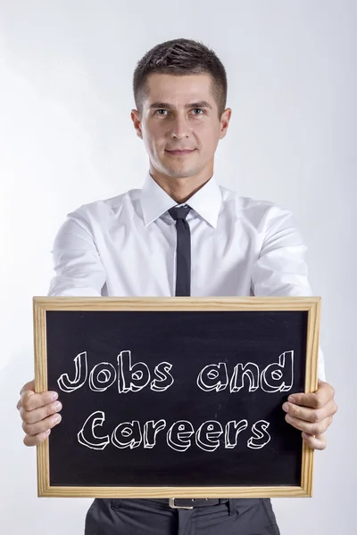 Jobs und Karriere - Jungunternehmer hält Tafel mit Text in der Hand — Stockfoto