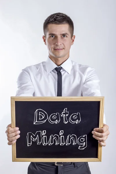 Data Mining - молодий бізнесмен тримає клавіатуру з текстом — стокове фото