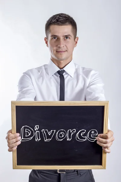 Divórcio - Jovem empresário segurando quadro com texto — Fotografia de Stock