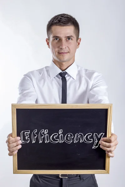 Efficacité - Jeune homme d'affaires tenant un tableau noir — Photo