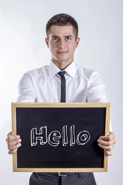 Hello - fiatal üzletember gazdaság chalkboard — Stock Fotó