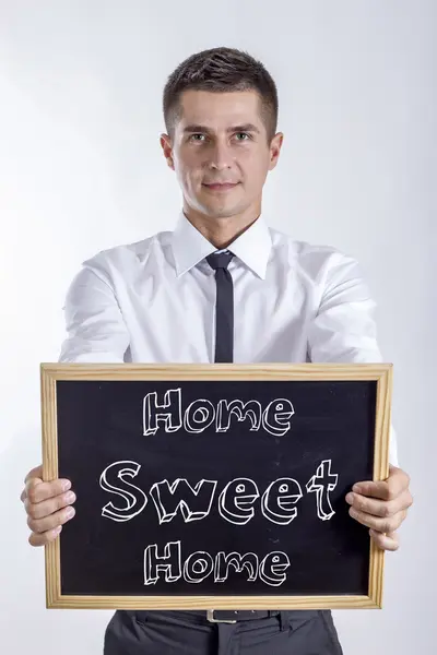 Home sweet home - junger Geschäftsmann mit Kreidetafel — Stockfoto