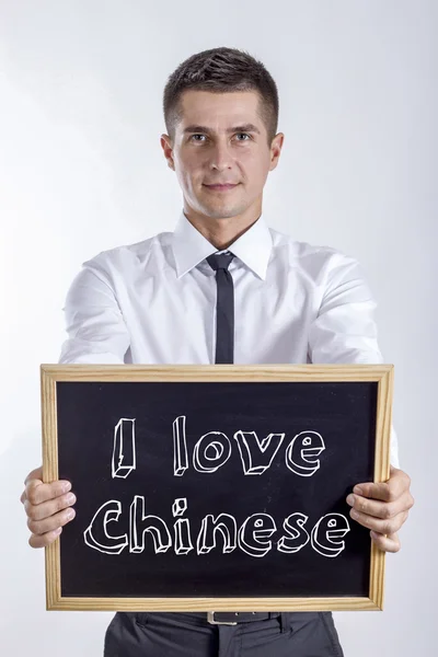 Adoro il cinese - Giovane uomo d'affari che tiene la lavagna — Foto Stock