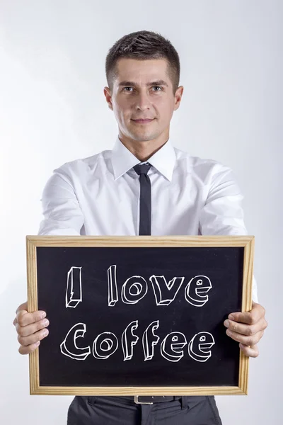 I love Coffee - Молодой бизнесмен, держащий в руках картонную доску — стоковое фото