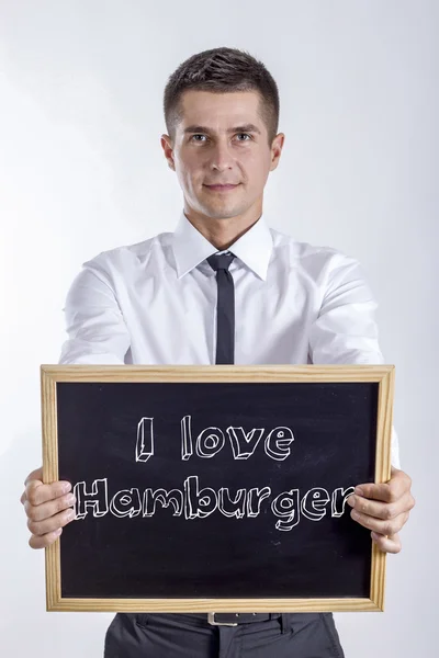 Ik hou van Hamburger - jonge zakenman houden schoolbord — Stockfoto