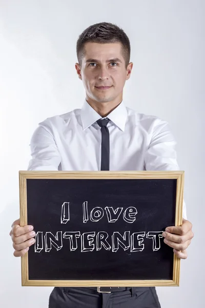 Eu amo INTERNET - Jovem empresário segurando quadro — Fotografia de Stock