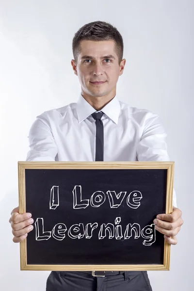 I Love Learning - młody biznesmen posiadania tablicy — Zdjęcie stockowe