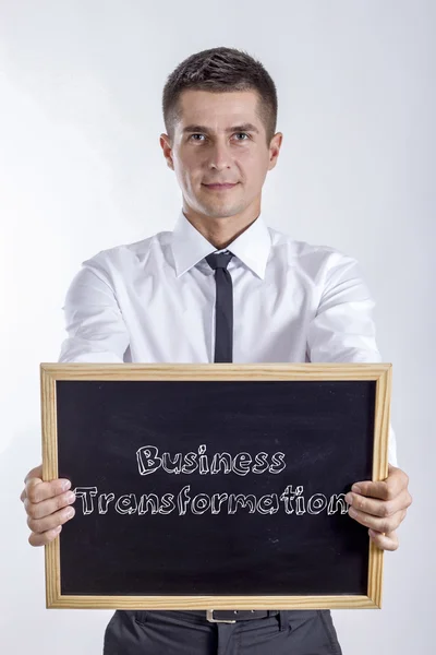 Transformação de negócios - Jovem empresário segurando quadro com texto — Fotografia de Stock