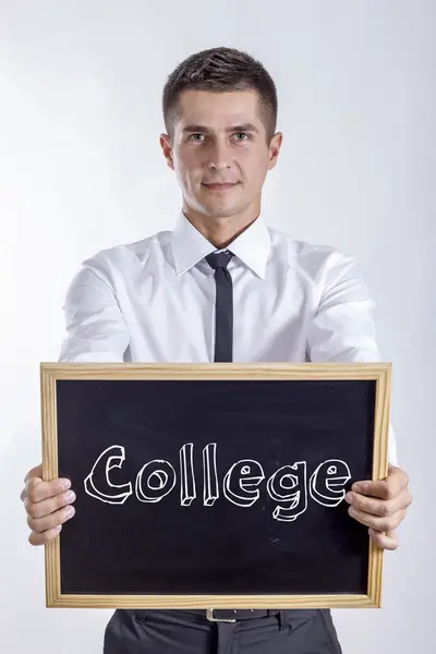 Škola - mladý podnikatel drží tabule s textem — Stock fotografie