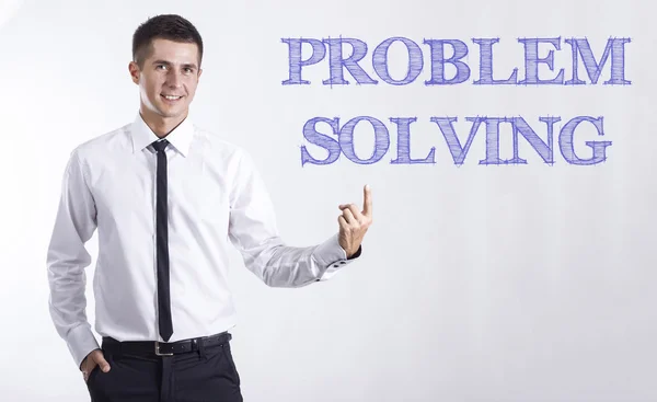 PROBLEMA SOLVING - Jovem empresário sorridente apontando texto — Fotografia de Stock