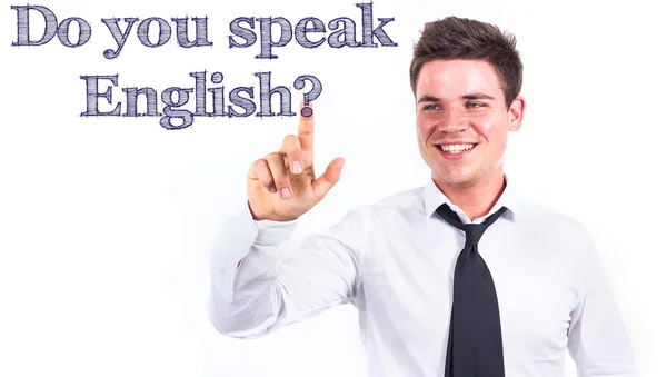 Ты говоришь по-английски? - Молодой улыбающийся бизнесмен трогает текст — стоковое фото