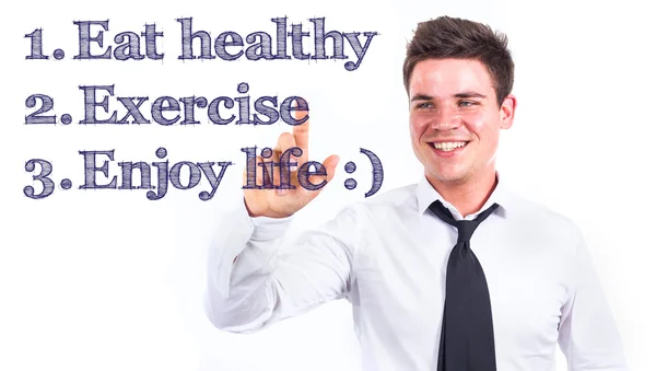 1. Mâncați sănătos 2. Exerciţiul 3. Bucurați-vă de viață:) - Tânăr om de afaceri zâmbitor atingând text — Fotografie, imagine de stoc