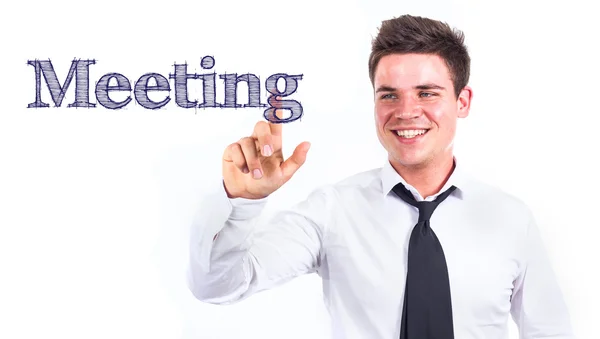 Зустріч - молодий усміхнений бізнесмен торкається тексту — стокове фото