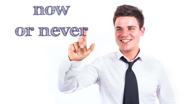 Now or never - Young smiling businessman touching text — Stock Photo, Image