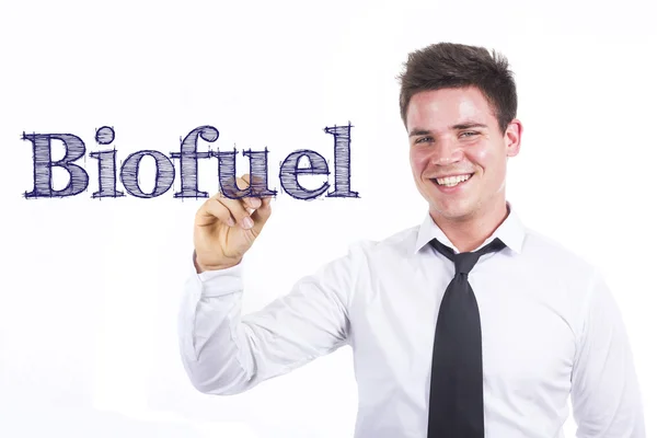 Biofuel - Jeune homme d'affaires souriant écrivant — Photo