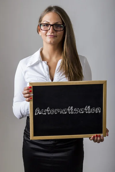 Automatization - Young businesswoman holding chalkboard with tex — Stock fotografie