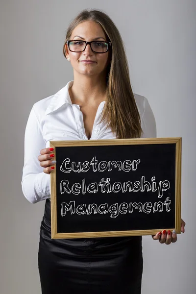 Customer Relationship Management  - Young businesswoman holding — Zdjęcie stockowe