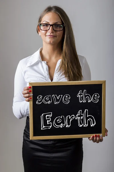Save the Earth - Young businesswoman holding chalkboard with tex — Zdjęcie stockowe