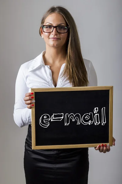 E-mail - young businesswoman holding chalkboard with text — Zdjęcie stockowe