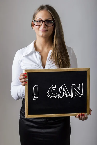 I CAN - Young businesswoman holding chalkboard with text — Stock fotografie