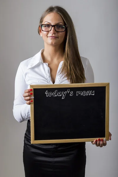 Today's menu - Young businesswoman holding chalkboard with tex — Stock Photo, Image