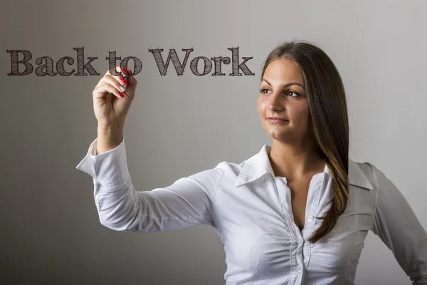 Terug naar Work - mooi meisje schrijven op transparante oppervlak — Stockfoto