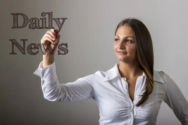 Daily News - Beautiful girl writing on transparent surface — Stock Photo, Image