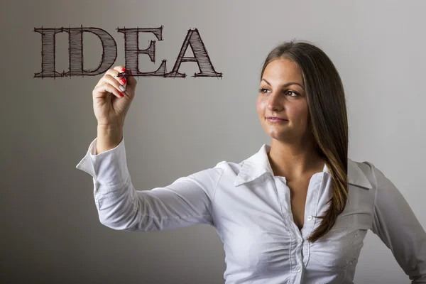 IDEA - Hermosa chica escribiendo en superficie transparente — Foto de Stock