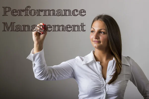 Performance Management - vacker flicka skriver på transparent s — Stockfoto