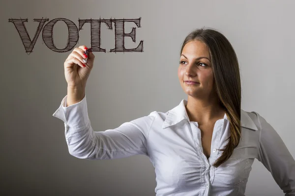 投票 - 透明な表面に書いている美しい女の子 — ストック写真