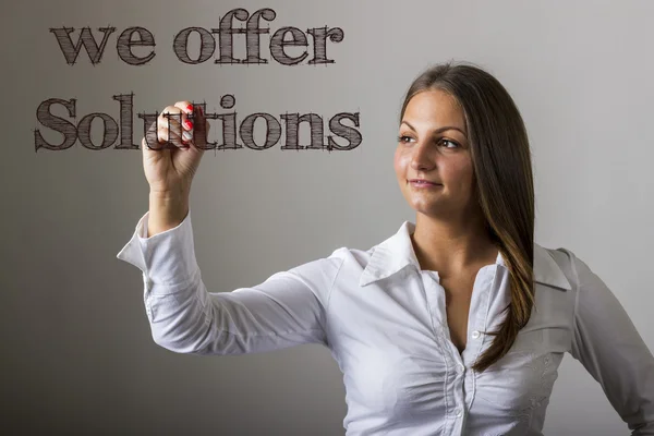 Ofrecemos soluciones - Hermosa chica escribiendo en surfa transparente — Foto de Stock